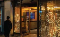 Transparent LED Window Display - EagerLED | Leading LED Screen Supplier Transparent LED screens displaying illuminated graphics in retail storefront windows