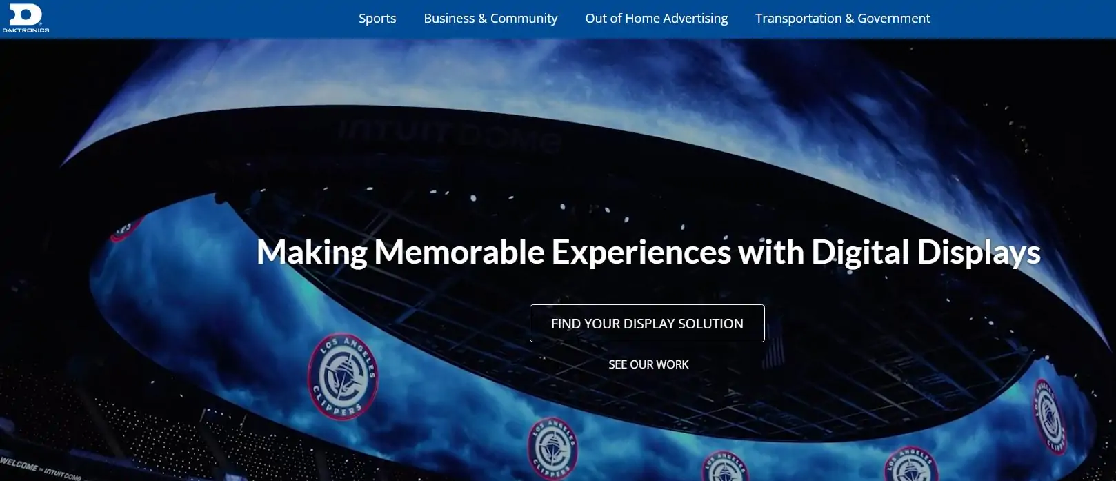 Hero banner for Daktronics: curved circular display arena with the headline 'Making Memorable Experiences with Digital Displays' and a 'Find Your Display Solution' button.