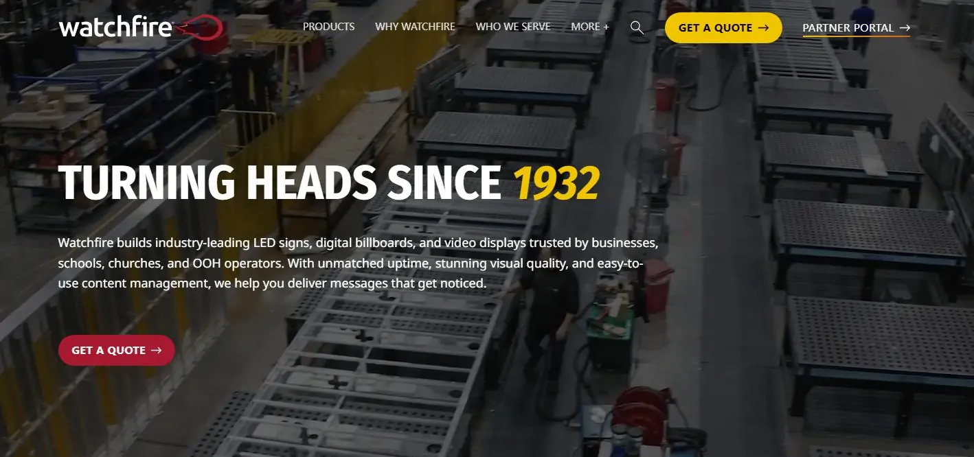 Industrial factory interior hero banner with large white text 'TURNING HEADS SINCE 1932' and a red 'Get a Quote' button on the left, Watchfire branding on top rail