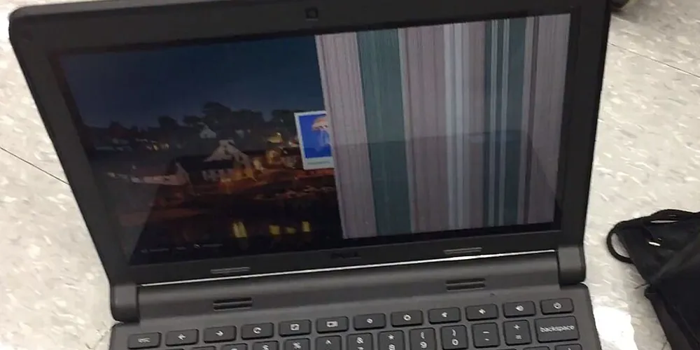 Laptop screen showing vertical bars caused by a faulty LCD connector