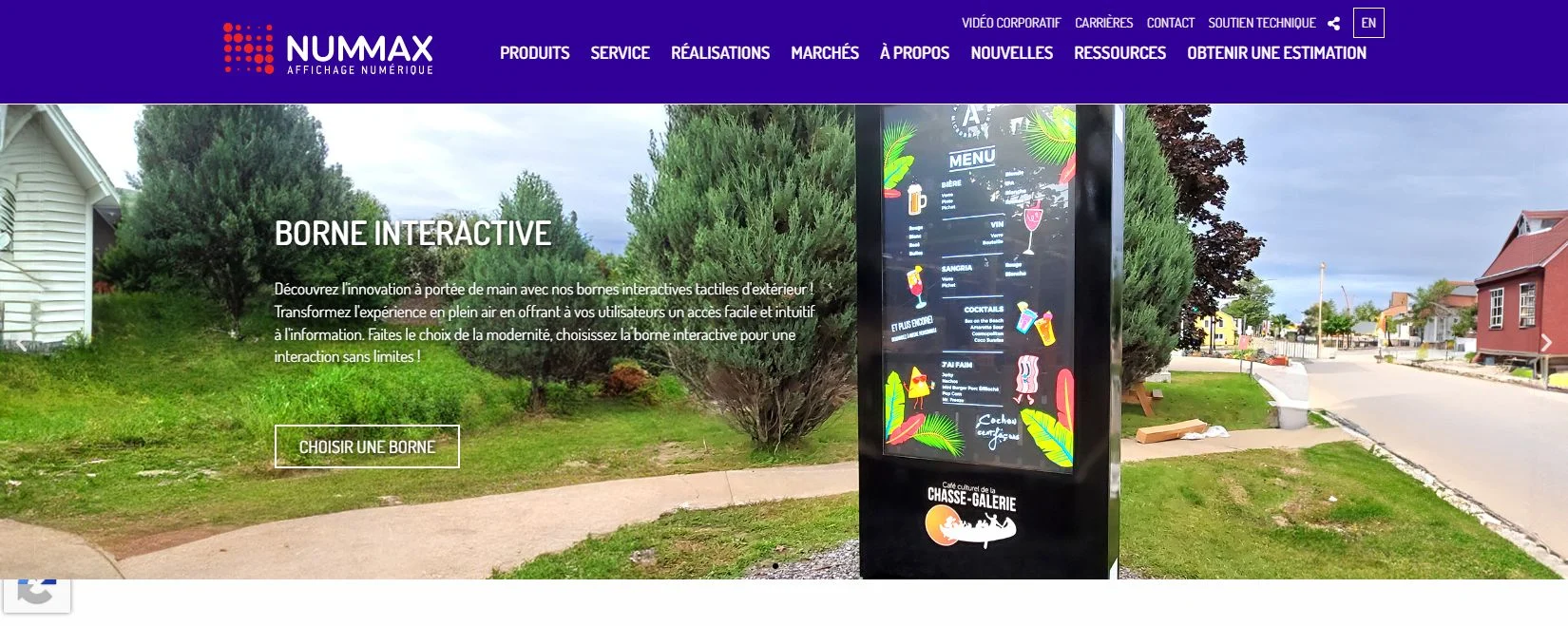 Nummax official homepage showing an outdoor interactive digital kiosk hero section