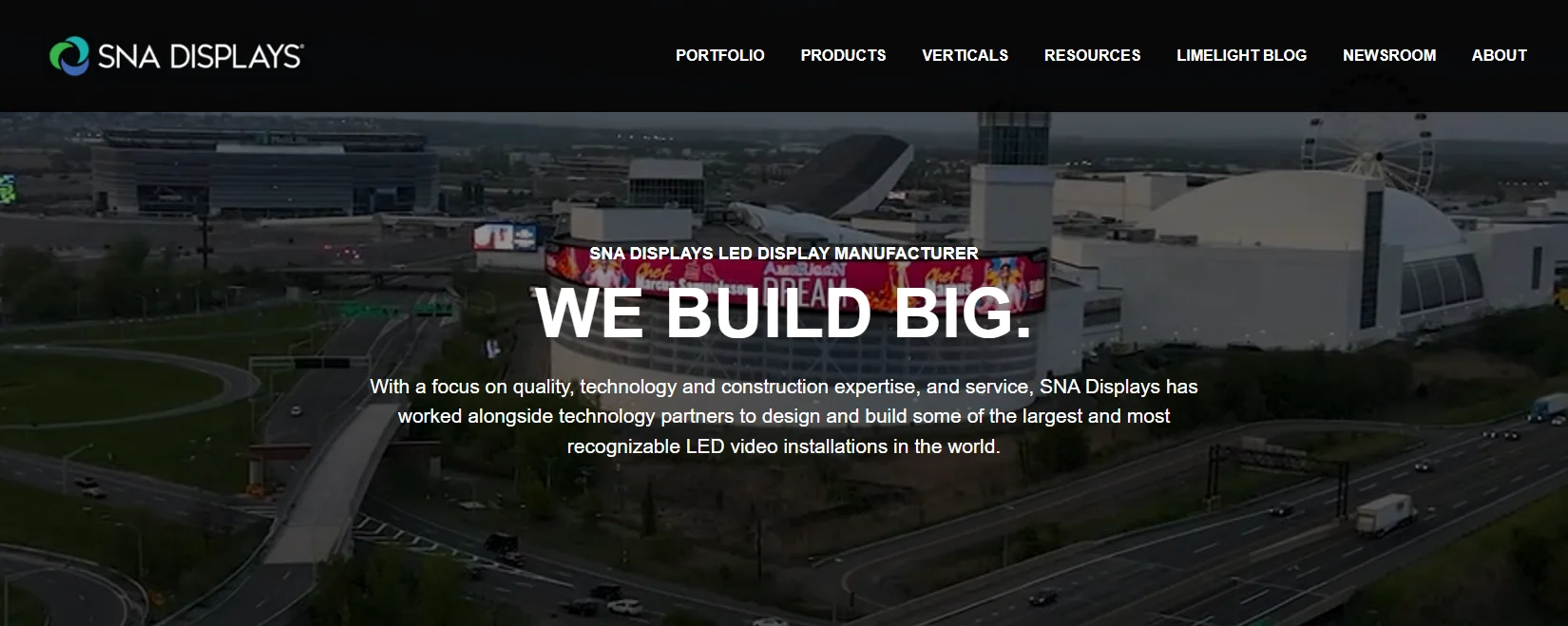 SNA Displays official homepage showing a large LED installation and company hero