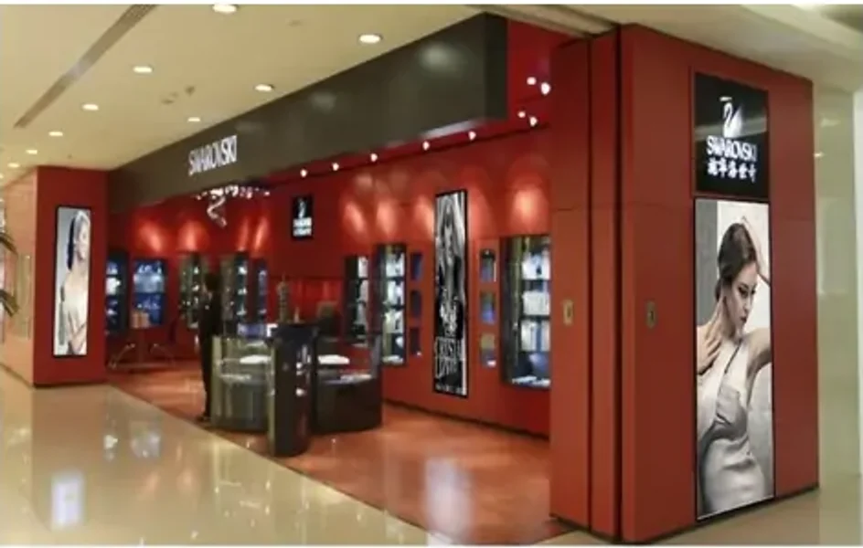 Indoor LED poster signs displaying retail promotions in a shopping mall