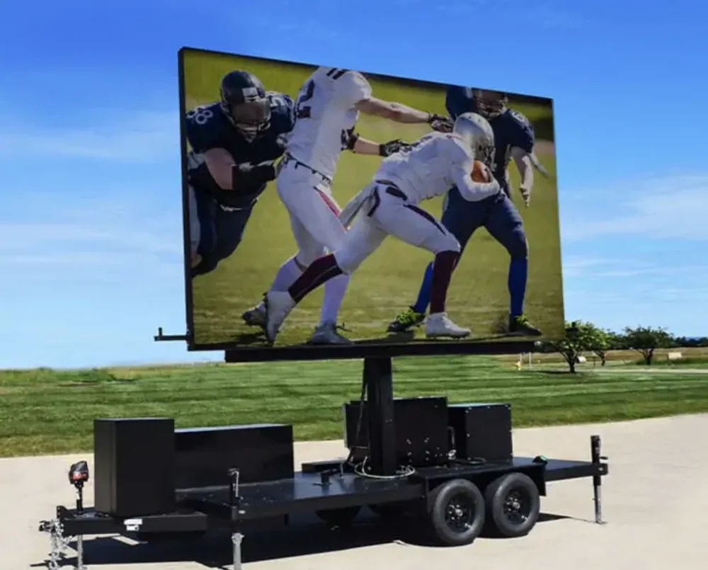 Towable mobile LED billboard trailer with lifting display and stabilizing equipment