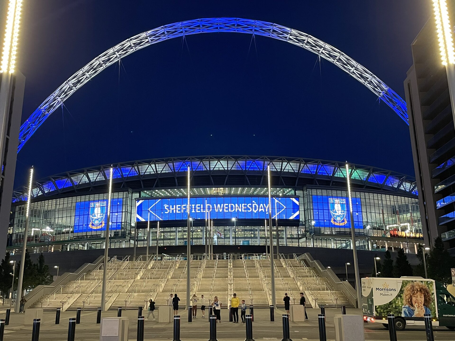Stadium exterior LED display facade installation on a modern arena building
