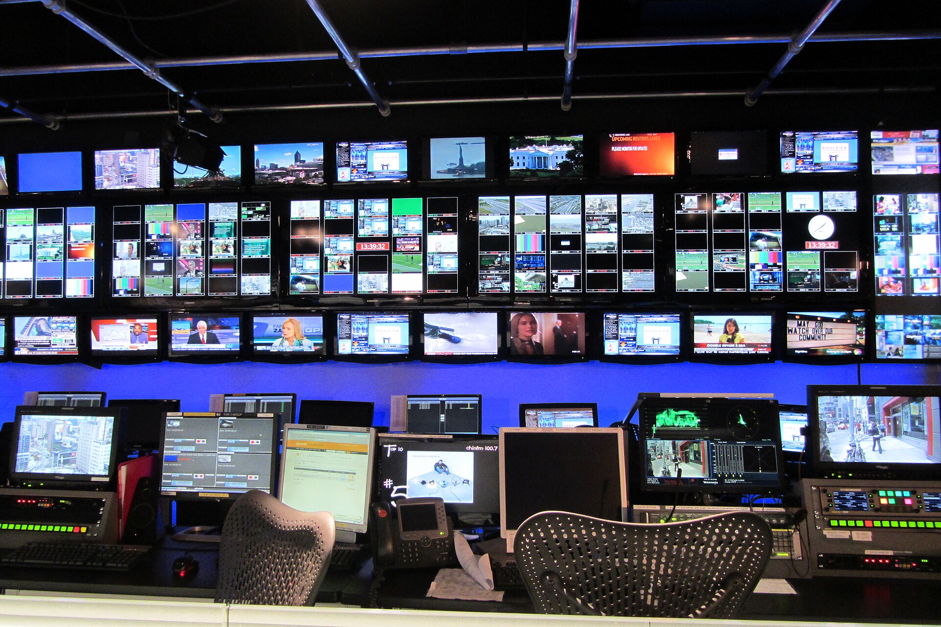 Stadium LED control room with video processing and signal monitoring equipment